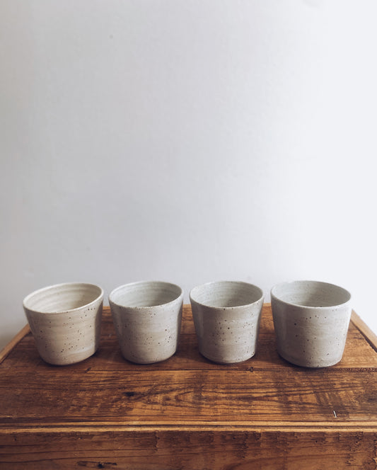Set of 4 speckled and white glazed mugs
