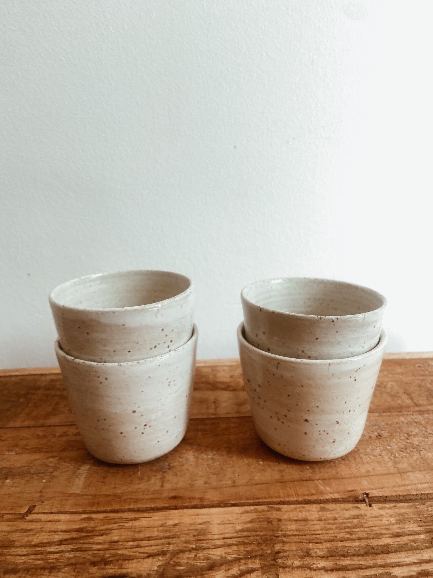 Set of 4 speckled and white glazed mugs